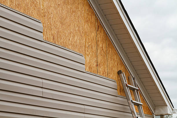 Professional Storm Damage Siding Repair technician working in Alverton, PA